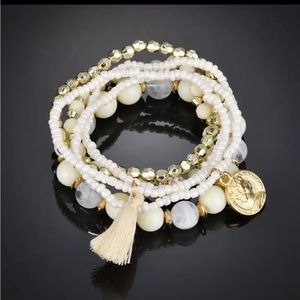 White and gold stretch bracelet set.